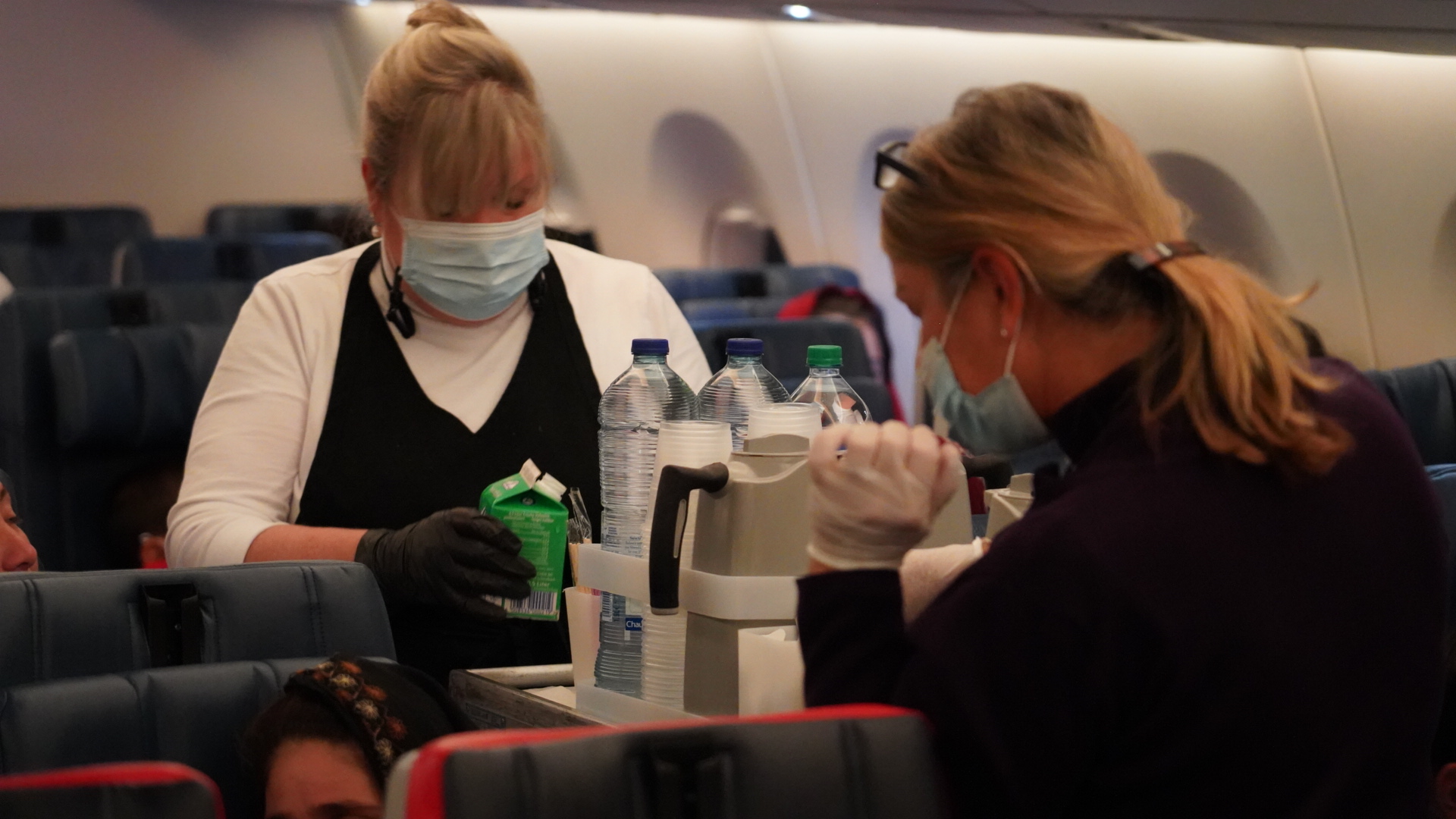 Delta Air Lines Flight Attendant serves passengers during CRAF mission.