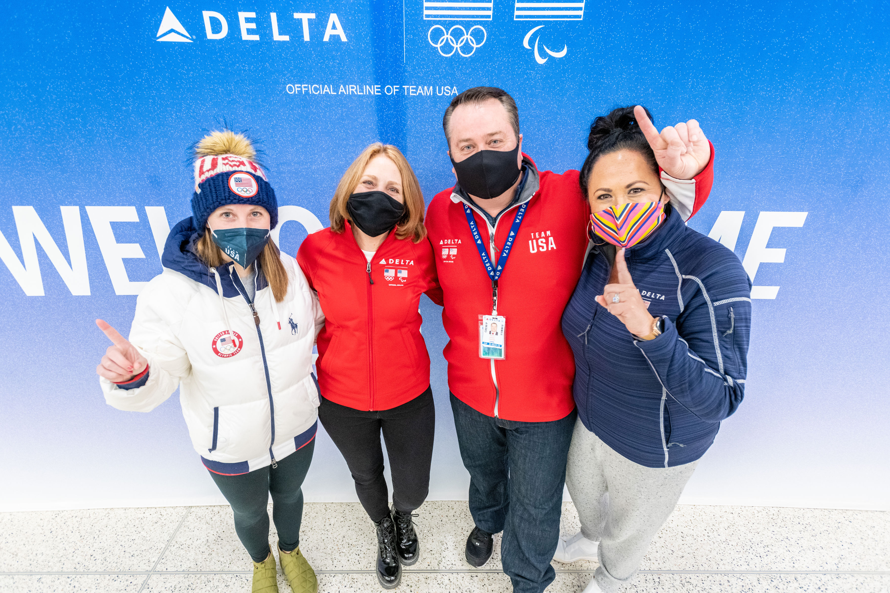 (Left to right) Nikki Leonard, fiancée of speed skater Ryan Pivorotto, Kris, a Delta Air Lines flight attendant, and Nikki's mother, Scott, a Delta Air Lines co-pilot and uncle of figure skater Brandon Frazier , and Heather, wife of Scott