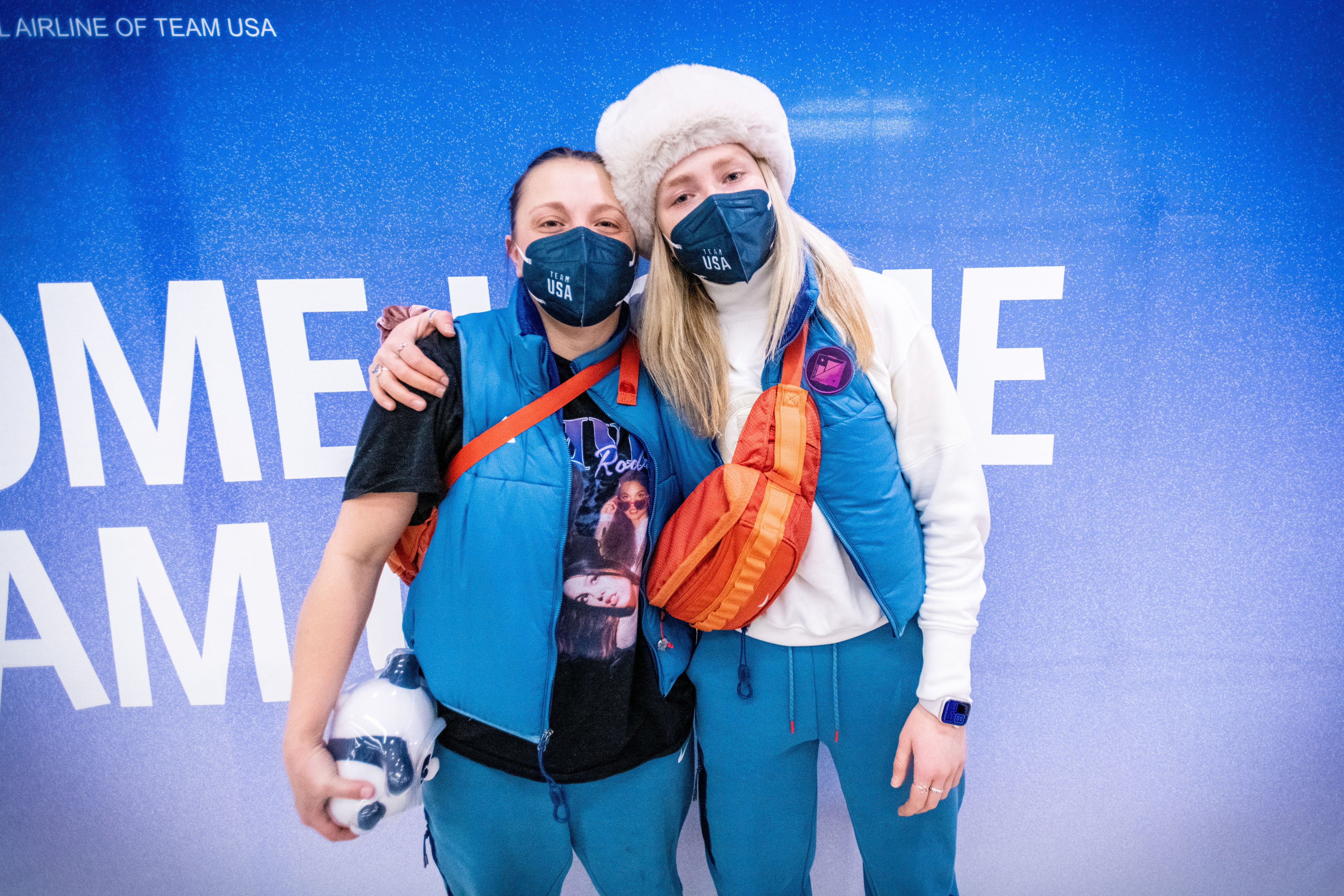 Freestyle skiers Darian Stevens and Maggie Voisin pose for a portrait as Team USA athletes arrive at Salt Lake City International Airport in Salt Lake City, Utah on Monday, Feb. 21, 2022.