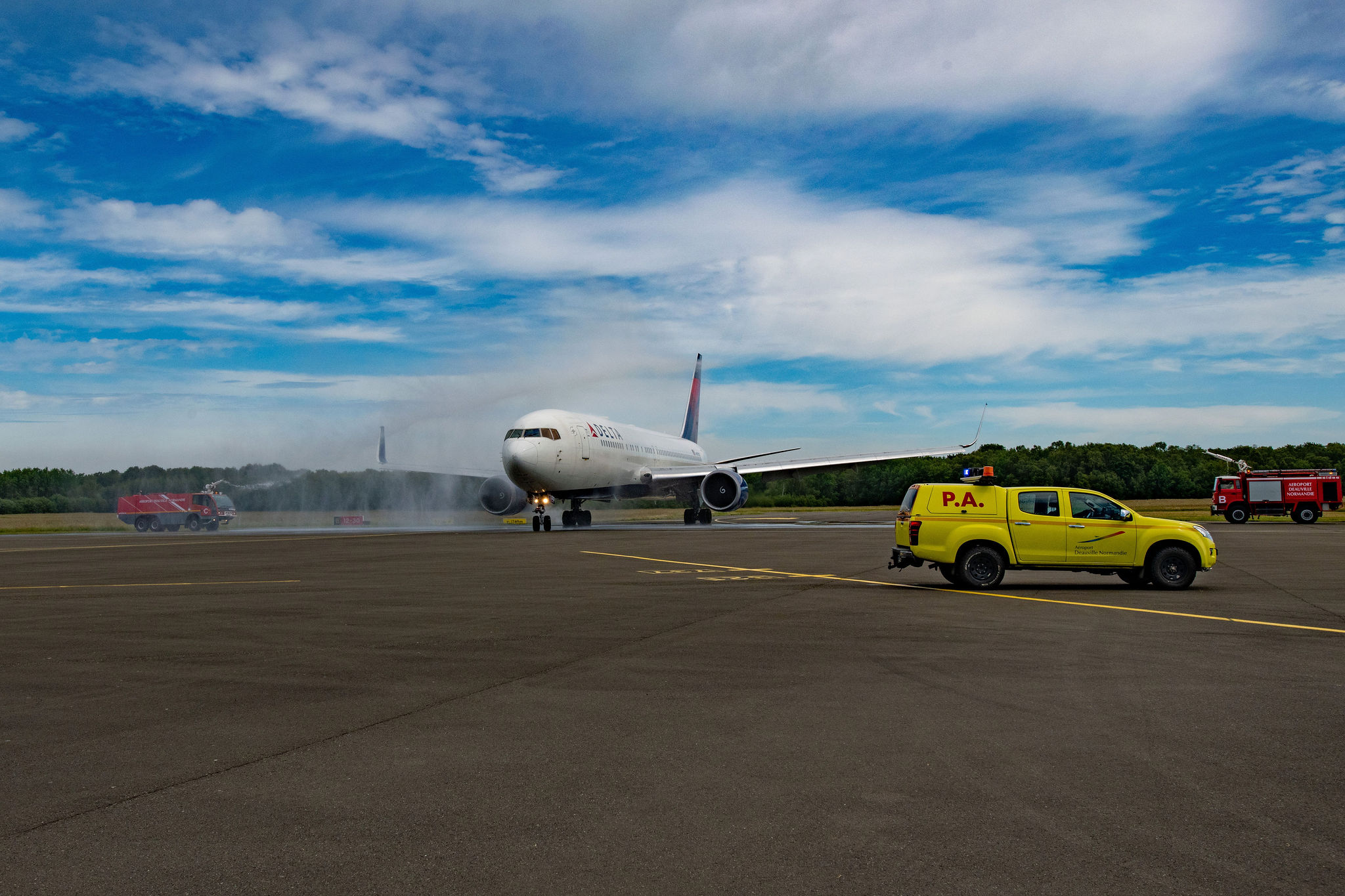 Delta makes its historic landing at DOL and is welcomed with a water cannon salute.