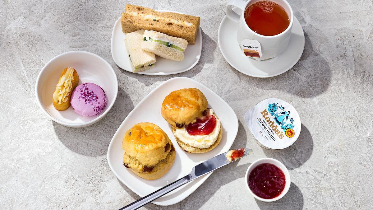 An afternoon tea pre-arrival menu selection in Delta One features scones, tea sandwiches, mini pastries and more.
