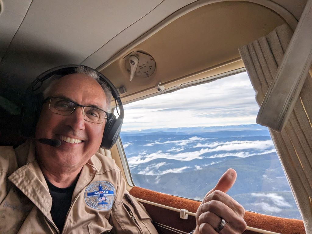 Delta pilot Barry Behnfeldt takes a selfie from the cockpit of his 1980 PA32R Piper Saratoga - the plane used to attempt the Guinness World Record of flying through 48 states in 48 hours.