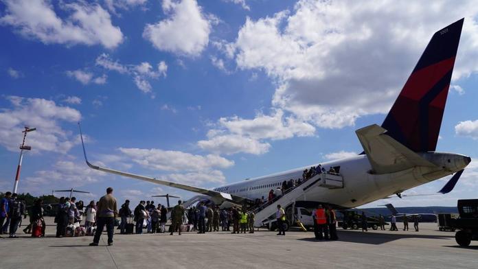 Passengers board a Delta plane at Ramstein Air Base.