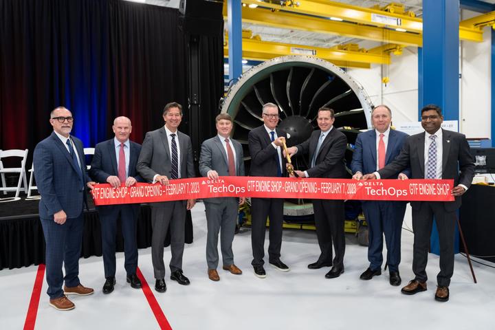 Delta and Pratt & Whitney officials celebrate the grand opening of a new repair facility.