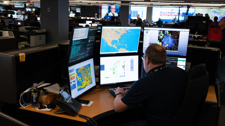 Warren Weston, a member of Delta's in-house meteorology team, sits as his desk in the Operations and Customer Center in Atlanta.