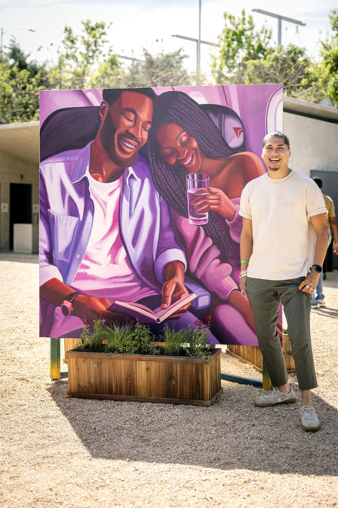 Delta, in partnership with Waterloo Greenway and Future Front Texas, demonstrated its commitment in Austin with the unveiling of a new mural, co-designed by the airline and local artists Ruben Esquivel of East End Eclectic and Kat Talley. Ruben poses next to the mural, which reflects a human-centric, connected vision for the future of the Austin community.