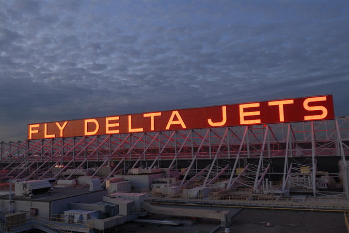 Lit up Fly Delta Jets sign at the Delta World Headquarters in Atlanta