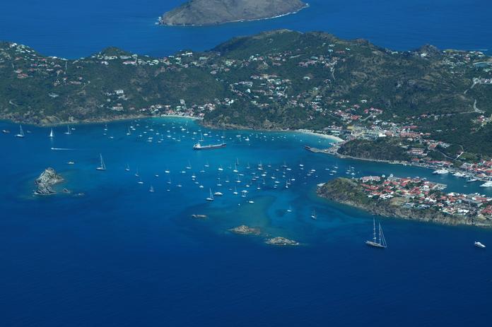 An aerial view of St. Kitts and Nevis with several yachts