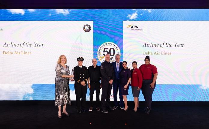 Delta CEO Ed Bastian was joined onstage by six uniformed employees to accept the ATW Airline of the Year Award and Hall of Fame Honor in Dubai on Friday, May 31.