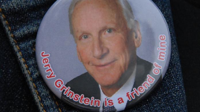 A button featuring former Delta CEO Jerry Grinstein that reads "Jerry Grinstein is a friend of mine."