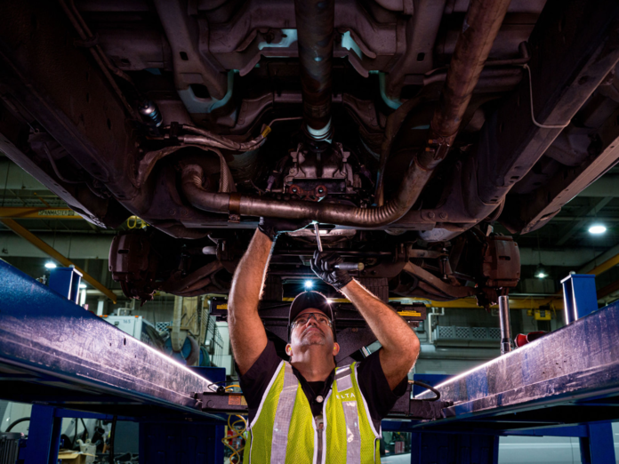 A member of Delta's Ground Support Equipment team helps maintain machinery.
