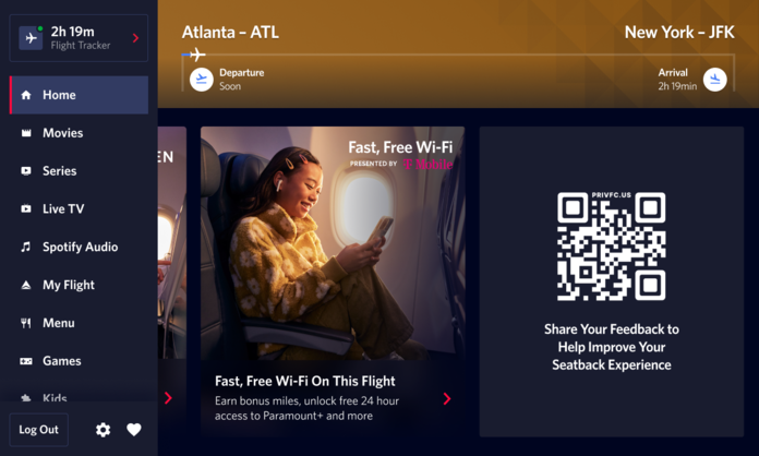 A seatback screen shows a QR code that gives customers the ability to give in-flight customer feedback.