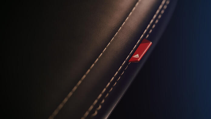 A close-up detail shot of the dress cover for Delta's cabin interior redesign