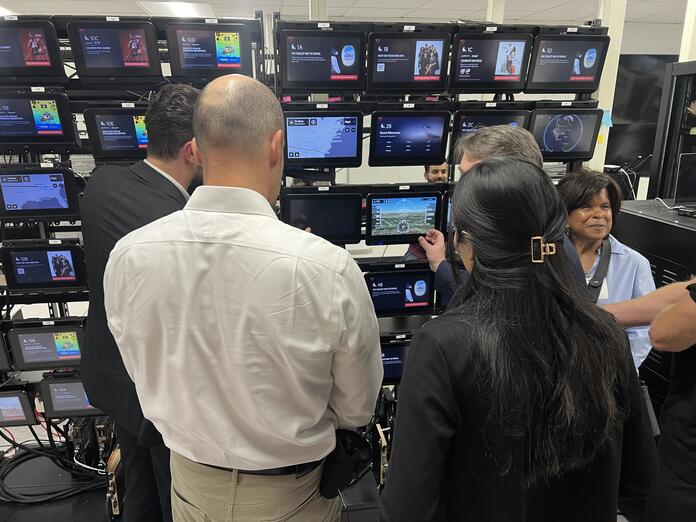 Members of the Advisory Board on Disability test Delta's new flight map in the In-Flight Entertainment lab.