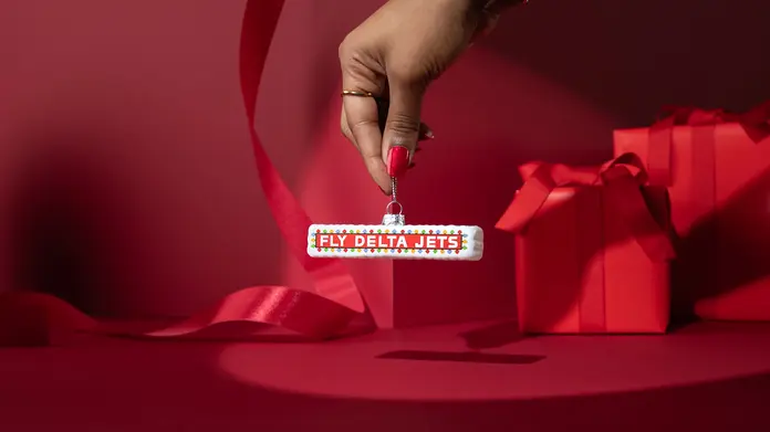 Add a flare of Delta history to your tree with our glass, Festive Fly Delta Jets ornament. Inspired by the sign that has welcomed travelers to and from Atlanta for over 50 years.