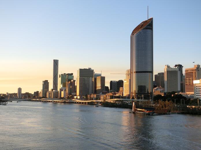 Aerial photo of skyscrapers overlooking a body of water in Brisbane, Australia