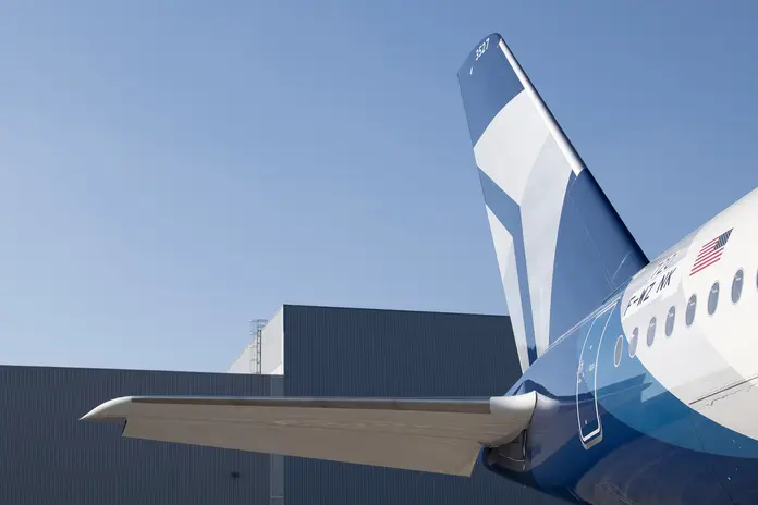 A detail shot of Delta's Centennial livery, featuring swooping designs and Delta's Centennial colors: blue and silver.