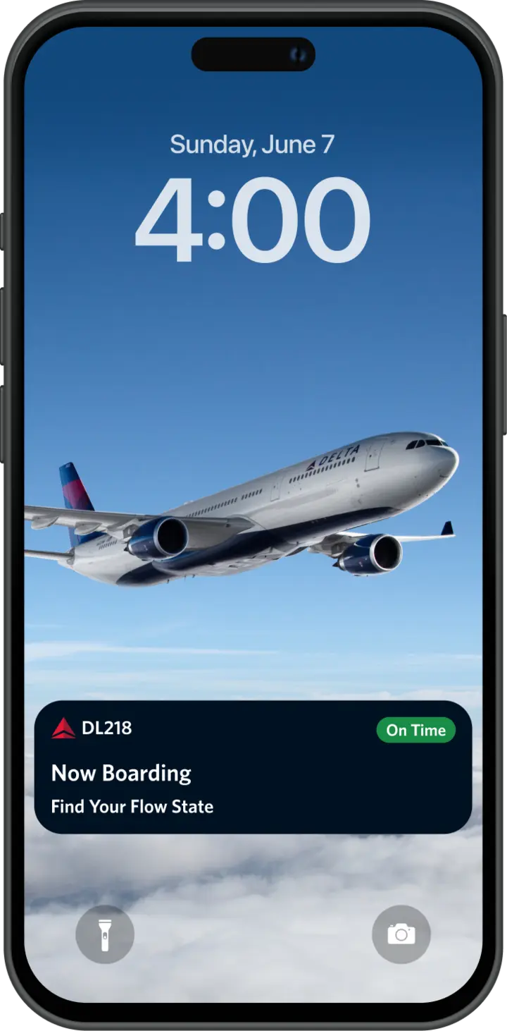 Smartphone lock screen showing a Delta airplane in flight with a notification reading “DL218 Now Boarding,” marked “On Time,” and the time displayed as 4:00 on Sunday, June 7.