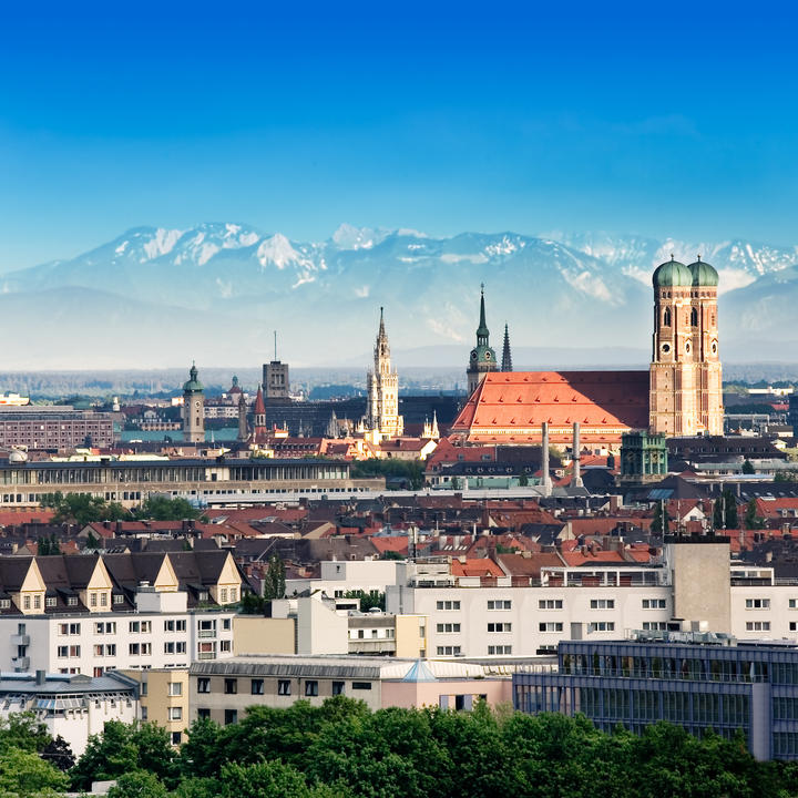 The skyline of Munich, the capital city of Germany's Free State of Bavaria, is seen with the Alps visible in the background.