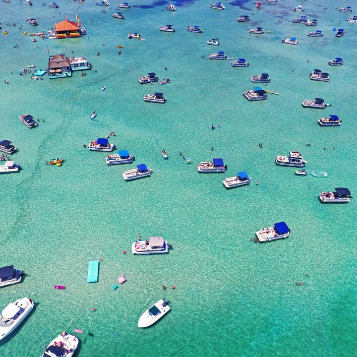 Aerial view of boats on crystal blue waters in Destin, Florida