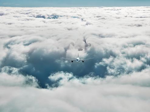 image of N8 Plane flying in clouds