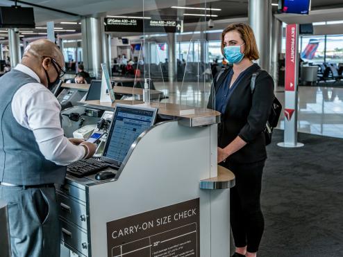 employee and customer in masks