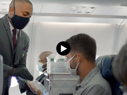 Delta CareStandard flight attendant with mask