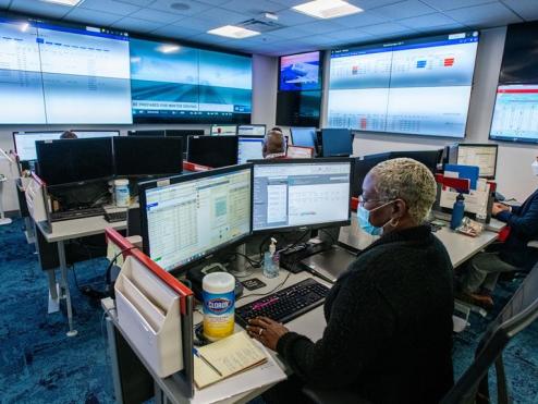 Employees in Delta's Vaccine Watch Tower