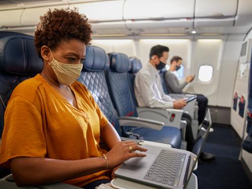 Customer on aircraft with mask