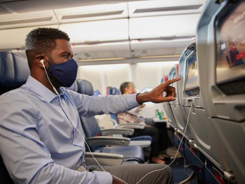 Delta customer using in-flight entertainment system