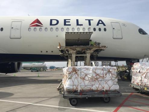 Shipments are loaded onto a Delta Cargo plane.