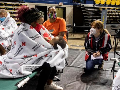 Families receive help at an American Red Cross shelter.