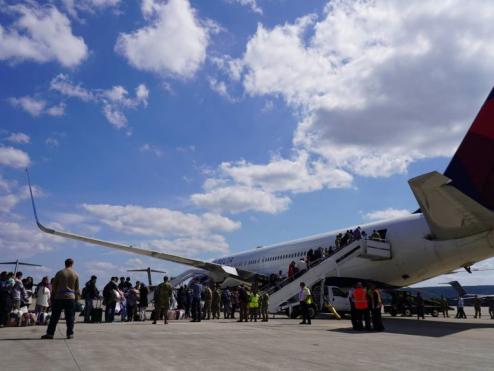 Passengers board a Delta plane at Ramstein Air Base.