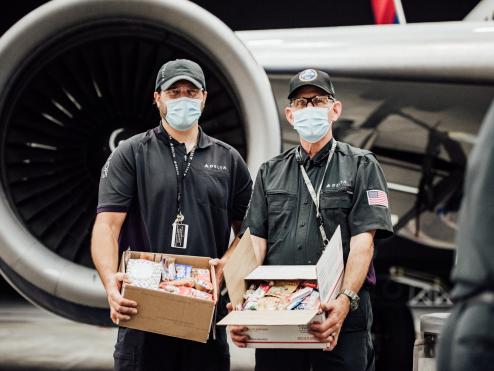 TechOps employee and veteran ships out 7,000th care package to military