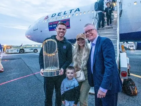 Ed poses with Freddie Freeman and his family.