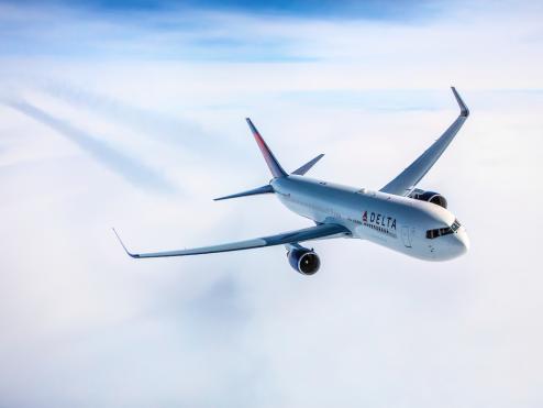 Delta aircraft in clouds