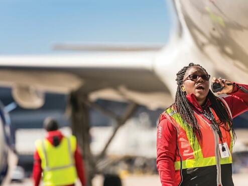 A Delta employee working on the ramps.