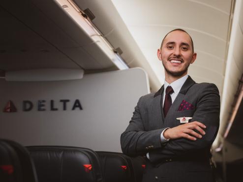 Delta flight attendant onboard an aircraft