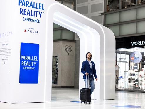 Delta customer entering the new PARALLEL REALITY experience at DTW.