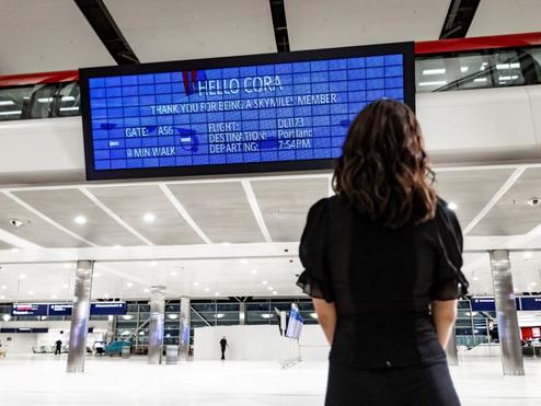 Customer at DTW looking at the new PARALLEL REALITY experience screen