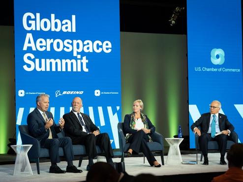 Capt. Patrick Burns (left) speaks on a panel at the U.S. Chamber of Commerce Global Aerospace Summit in September 2022.