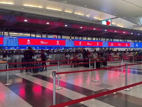 Delta’s signature digital backwall with up-to-date gate information at New York - JFK.