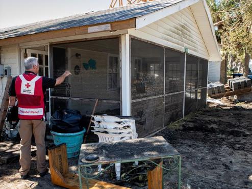 An American Red Cross volunteer aids the needs of others in the wake of Hurricane Helene.