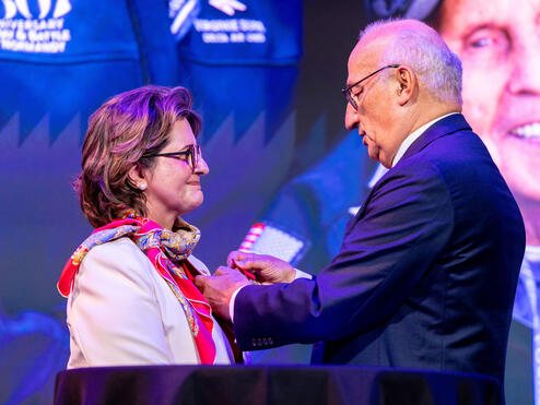 Ambassador of France Philippe Étienne presents French Legion of Honor to Virginie Durr.