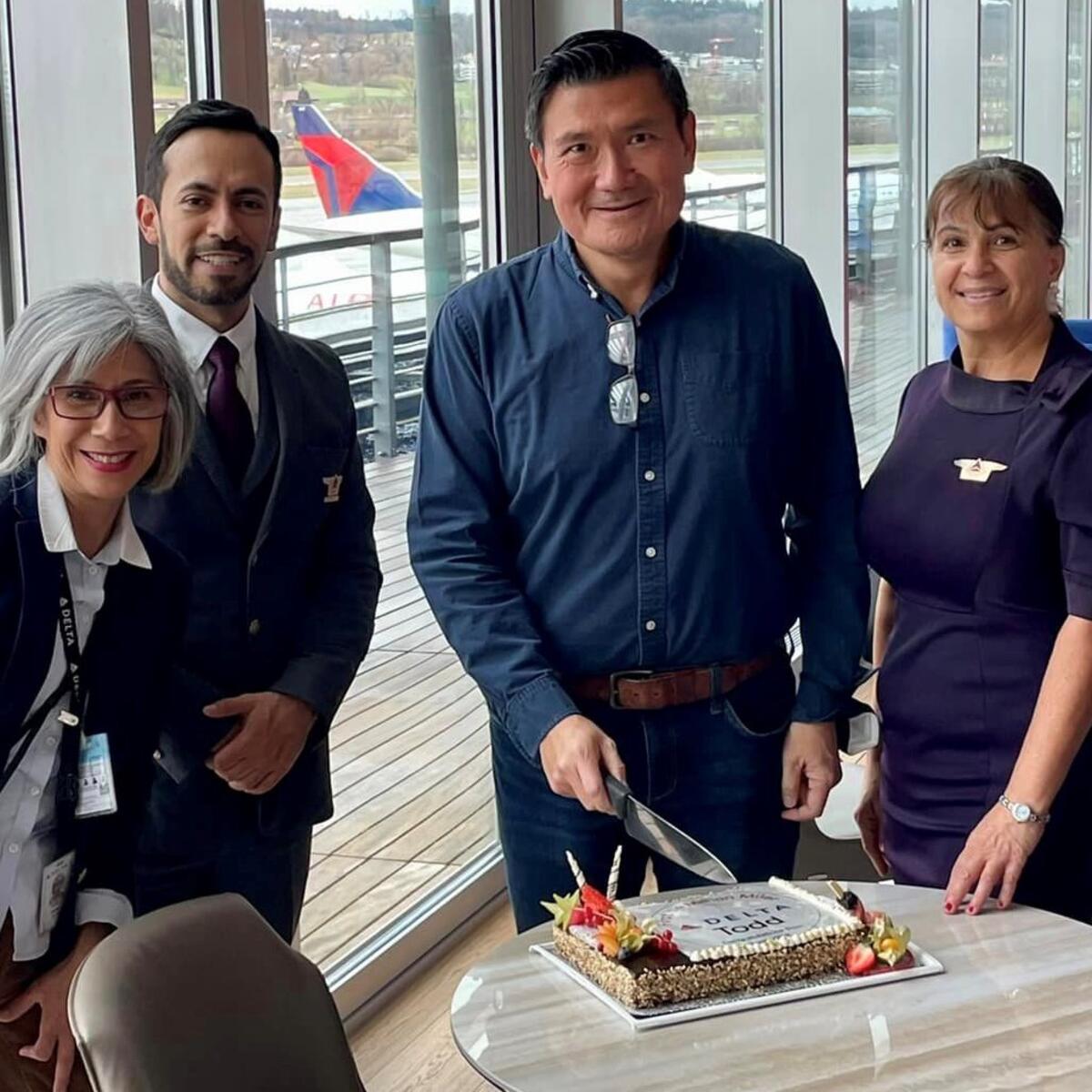 Todd O. celebrates achieving 14 Million Mile status with Delta people at Zurich Airport (ZRH).