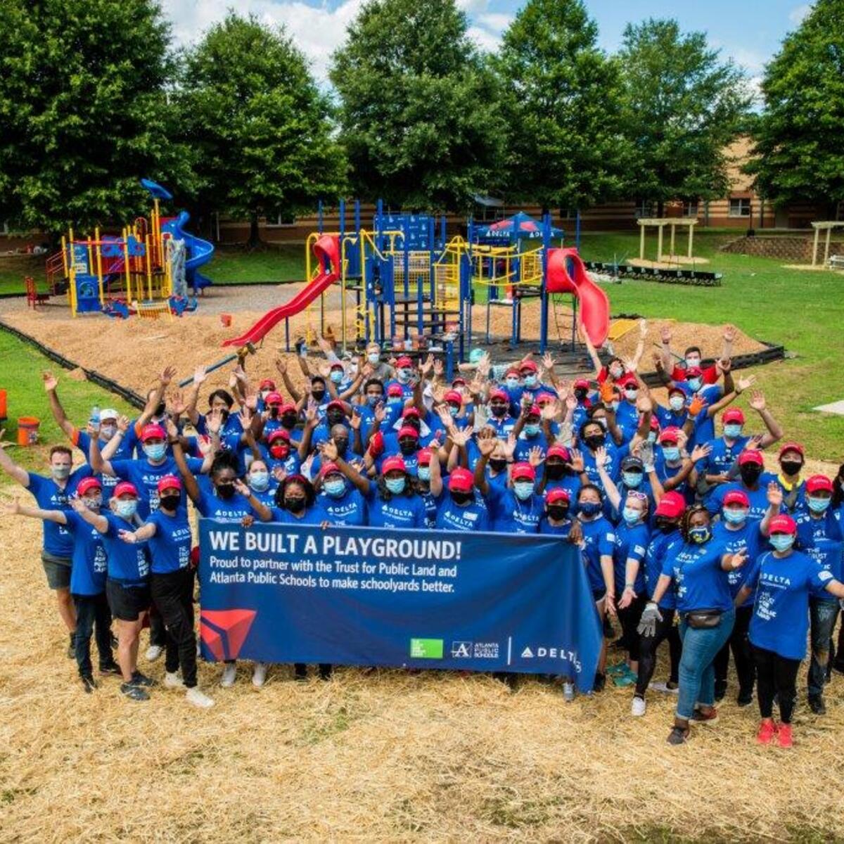 Delta volunteers build playground at Dobbs Elementary School - TPL