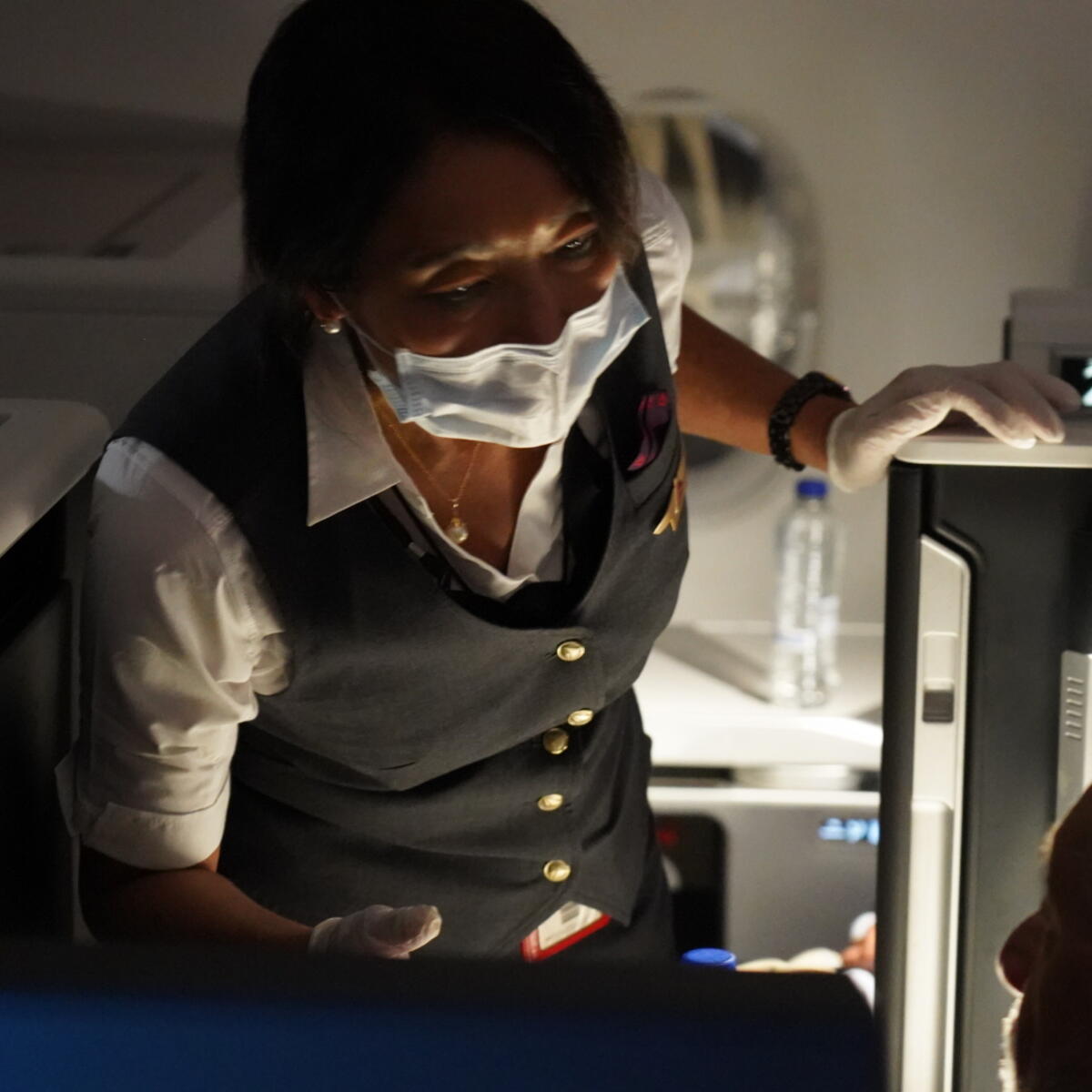 Delta Air Lines Flight Attendant serves passengers during CRAF mission.