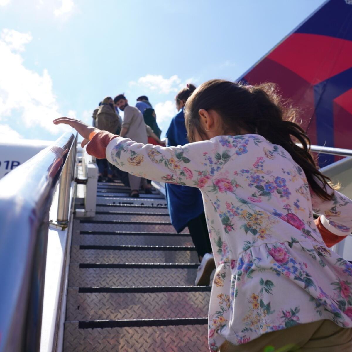 Evacuees from Afghanistan board at Ramstein air base.