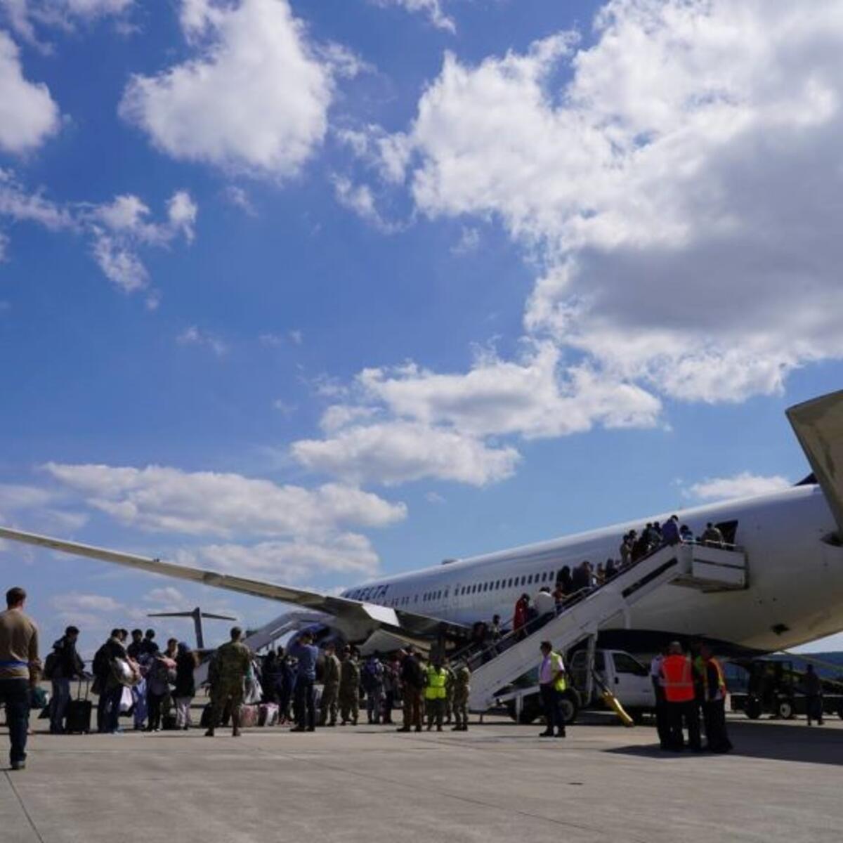Passengers board a Delta plane at Ramstein Air Base.