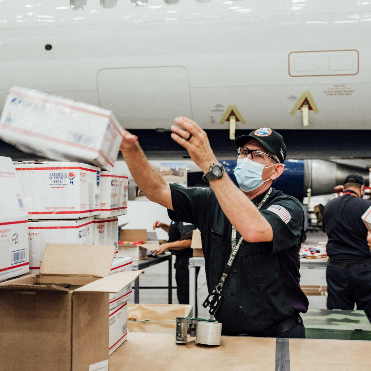 TechOps employee and veteran ships out 7,000th care package to military